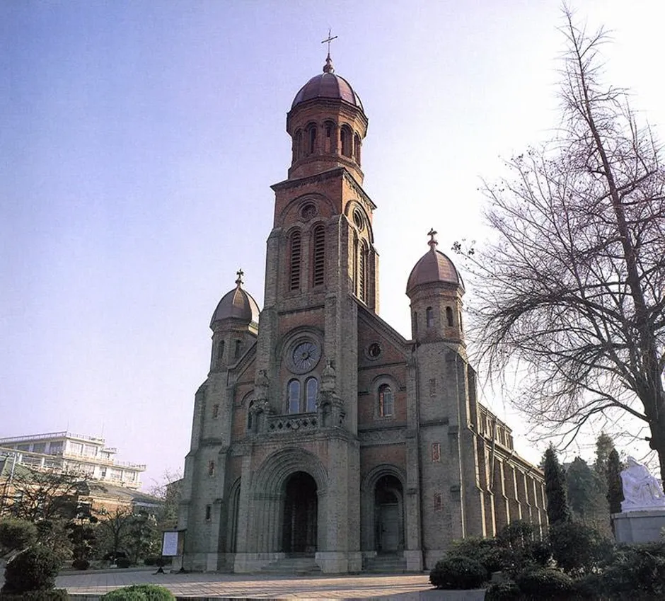 The red brick facade and domed bell tower of Jeondong Catholic Cathedral